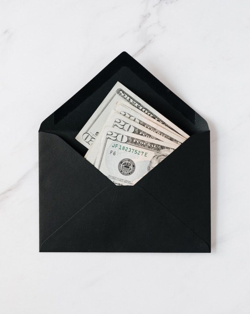 paper bills on black envelope