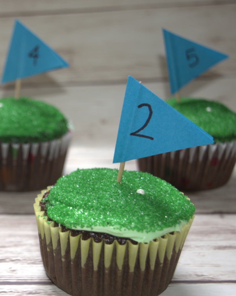 Tee off Father's Day with these adorable golf cupcakes! This recipe is easy to follow, using a store-bought cake box and common ingredients you can find at the grocery store.