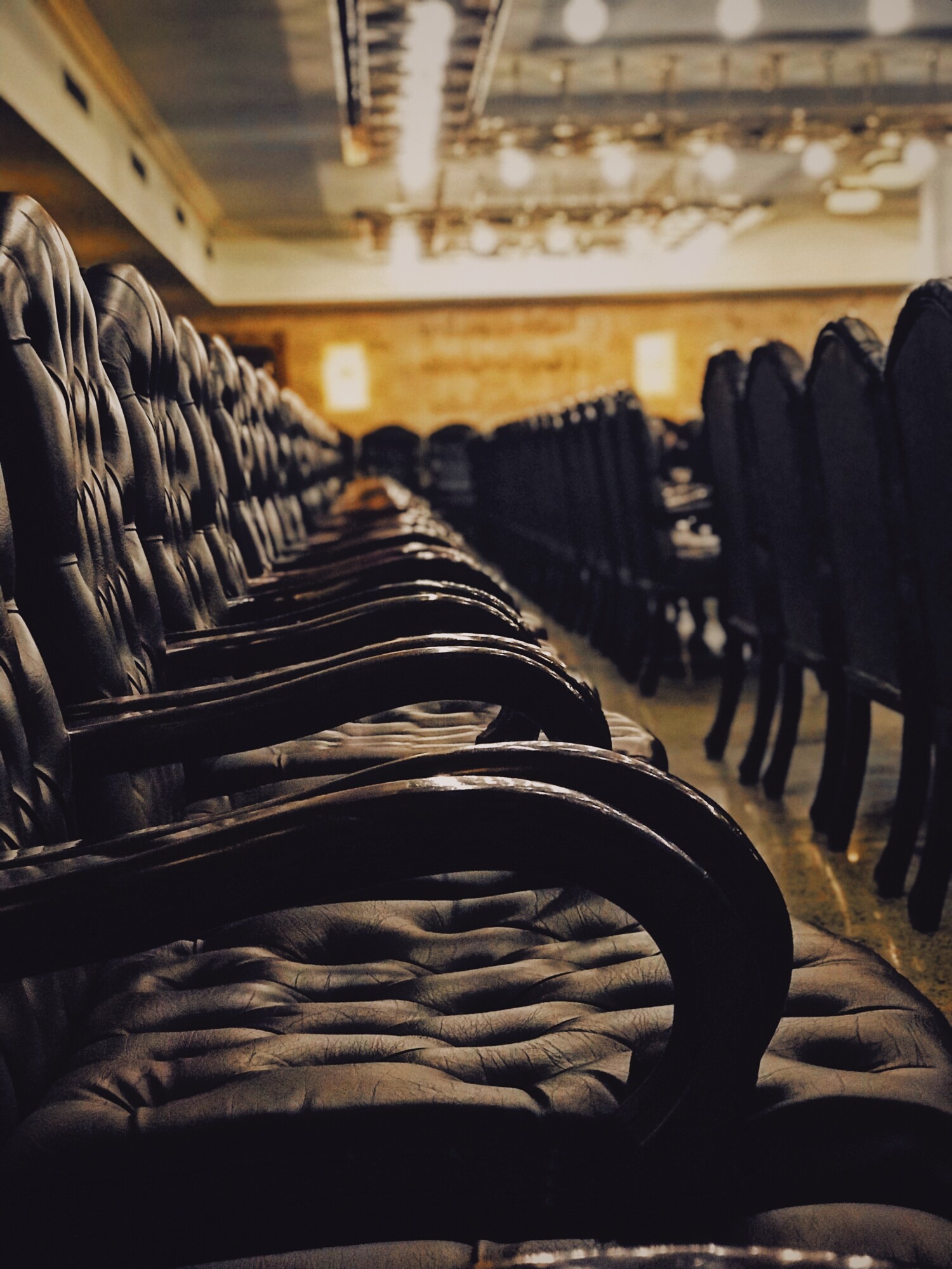A Time to Kill by John Grisham Book Review & Summary 2 tufted black chairs inside building with no people