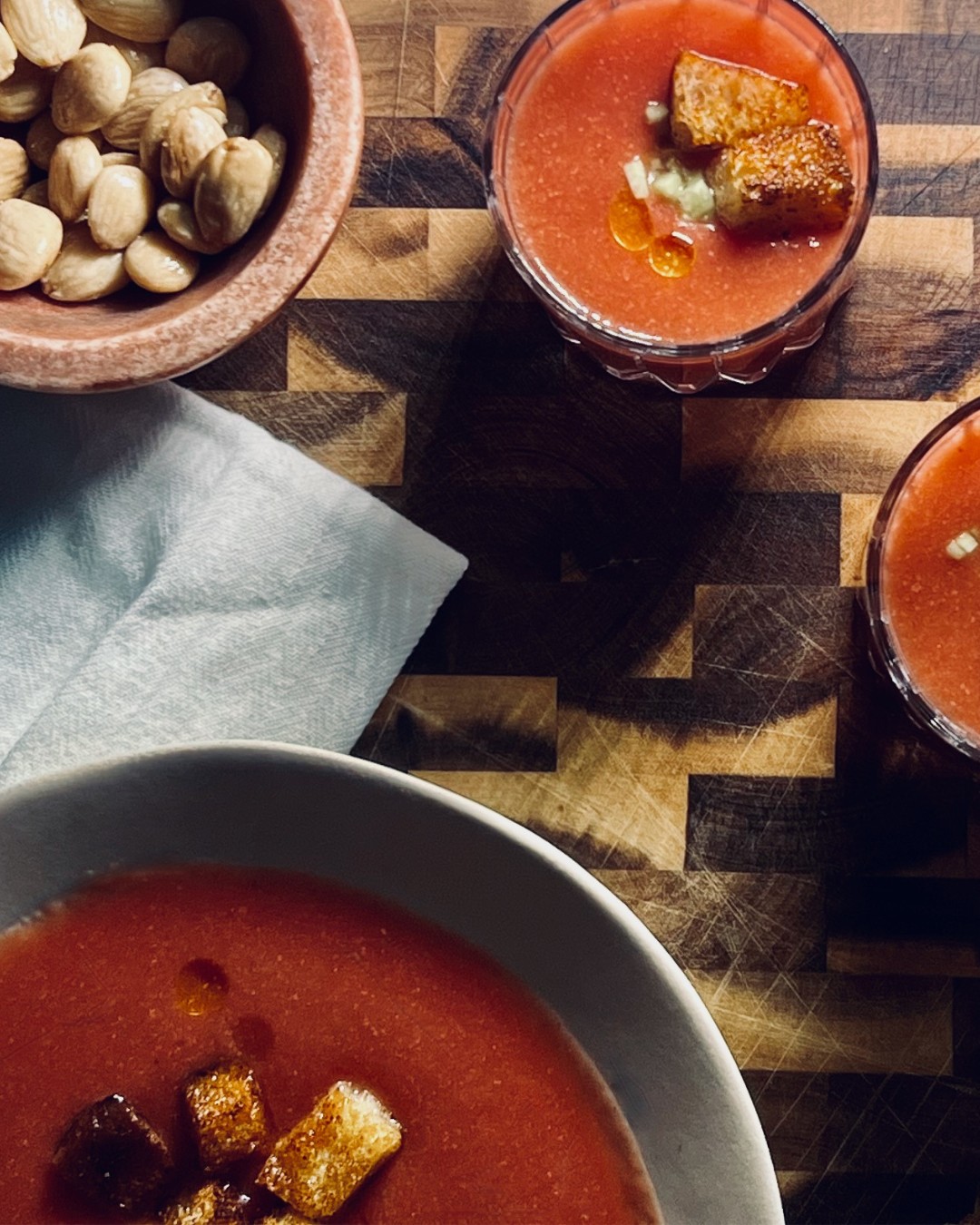 This gazpacho soup recipe is simple yet magical. Better yet, you don't have to turn on the oven. Use up that bounty from the garden to whip this up in no time. The combination of tomatoes, bread, cucumbers, bell pepper, oil, garlic, and sherry vinegar in the Spanish soup is fabulous as a starter, main dish, or even an amuse-bouche. Try serving it in shot glasses for tapas!